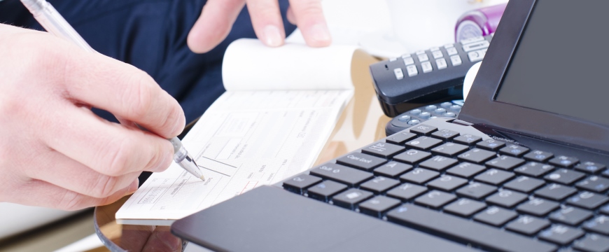 Iowa State Savings Bank Businessman writing a check