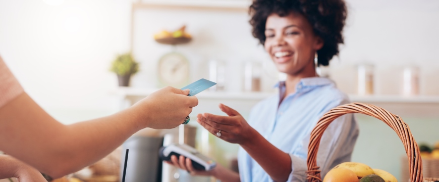 Businesswoman accepting a debit card for payment